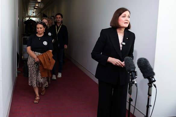 Opposition communications spokeswoman Sarah Henderson criticises ABC staff for striking as they leave Parliament House behind her.