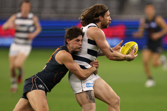 Zach Tuohy is tackled by Conor Stone.