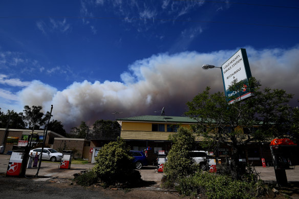 Smoke from the Gospers Mountain fire near Colo Heights, north-west of Sydney, was streaming across parts of the city on Friday afternoon.