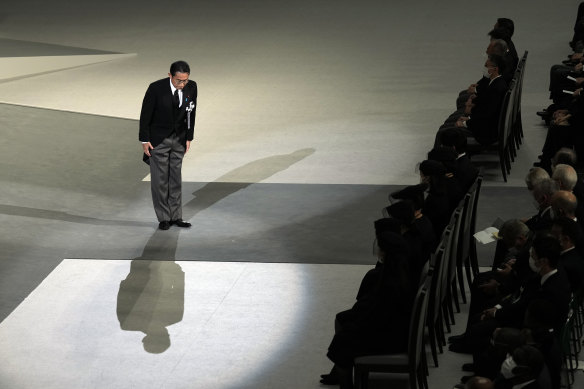 Japan’s Prime Minister Fumio Kishida bows before he sends his condolences during the state funeral.