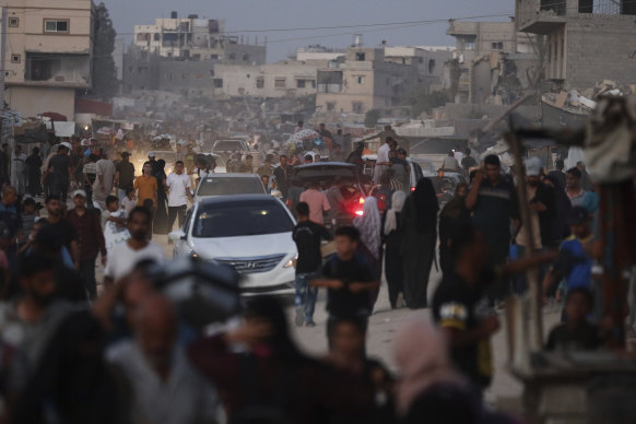 Palestinians flee parts of Khan Younis after an Israeli evacuation order.
