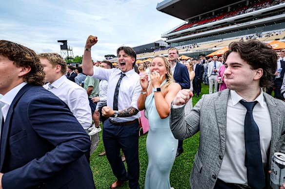 Will Papas and Charli Gardner (centre) celebrate a win on Stokke in race one.