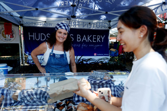 Stall holder Sandra Hudson serves customers at the Kings Cross markets.