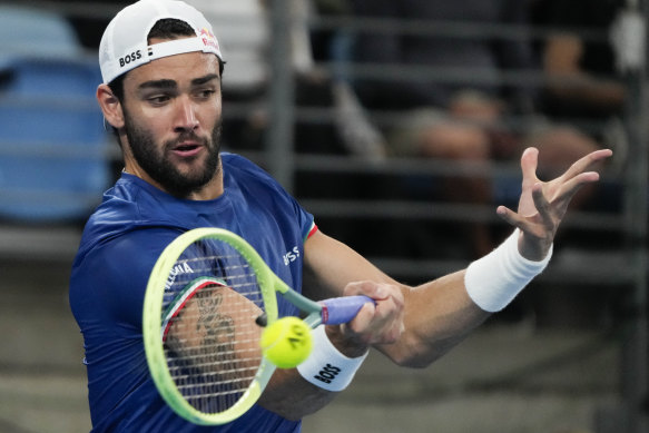 Italy’s Matteo Berrettini plays a forehand return to Stefanos Tsitsipas of Greece during their semi-final match at the United Cup tennis event in Sydney.