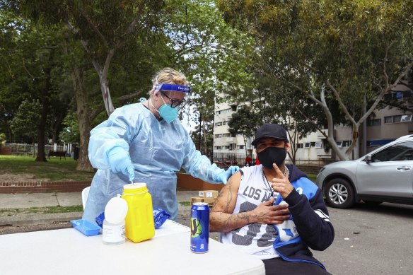 Raymond King gets his COVID-19 jab at the pop-up clinic set up at the Waterloo social housing estate in Sydney’s inner south. 