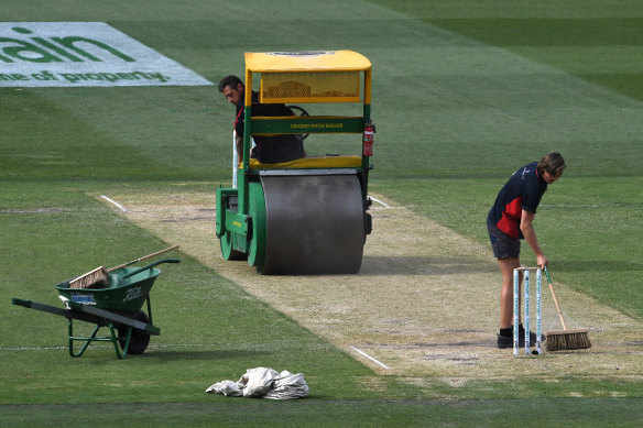 "Average": Groundsmen roll the pitch on day two of last year's Boxing Day Test at the MCG.