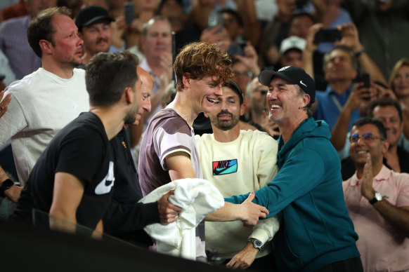 Jannik Sinner celebrates with Darren Cahill after the men’s singles final.