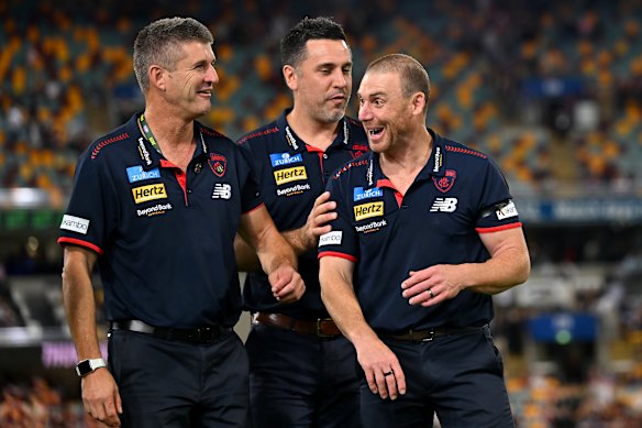 Simon Goodwin has a laugh with his coaching staff.