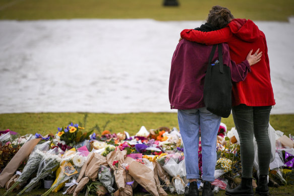 Mourners at the makeshift memorial where Eurydice Dixon's body was found.