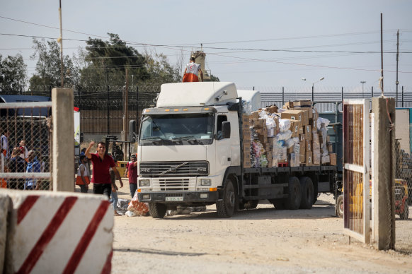 The first aid trucks arrive in Gaza, but the UN says 100 trucks are needed every day.