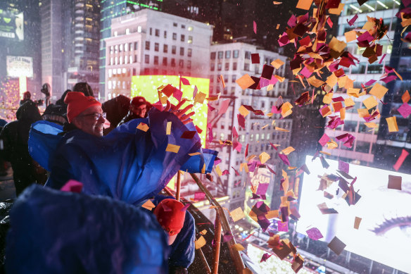 Confetti is thrown over Times Square during the annual New Year’s Eve celebration.