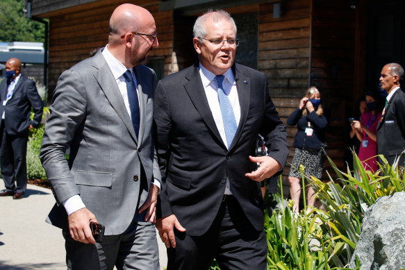 European Council President Charles Michel and Australian Prime Minister Scott Morrison arrive for a plenary session of the G7 summit in Cornwall, south-west England on Sunday.