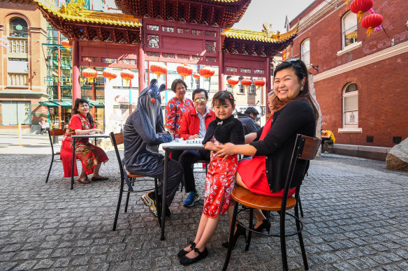 A family plays mahjong in Chinatown ahead of Lunar New Year celebrations.  