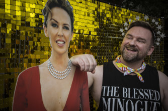 Hi Kylie: superfan Owen Lambourn poses next to a Kylie Minogue cardboard cutout at the festival.