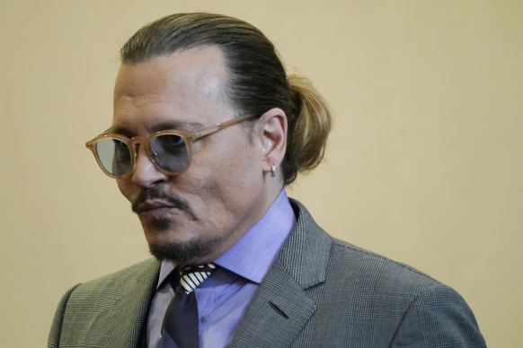 Actor Johnny Depp returns to the courtroom after lunch break at the Fairfax County Circuit Court.