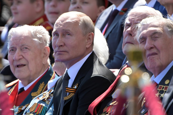 Vladimir Putin with veterans at the Victory Day parade on Tuesday.