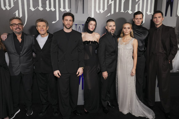 Chris Columbus, from left, Willem Dafoe, Aaron Taylor-Johnson, Emma Corrin, Robert Eggers, Lily-Rose Depp, Bill Skarsgård and Nicholas Hoult arrive at the premiere of Nosferatu.