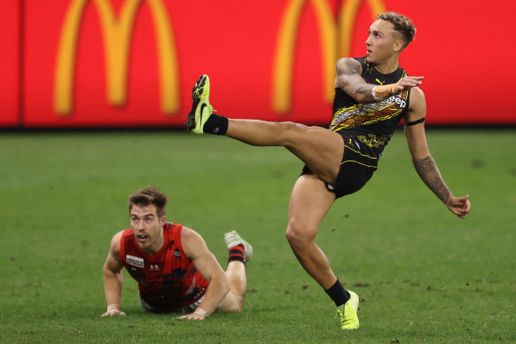 Shai Bolton takes a shot on goal as a seemingly helpless Zach Merrett watches on during last year’s Dreamtime game at Optus Stadium.