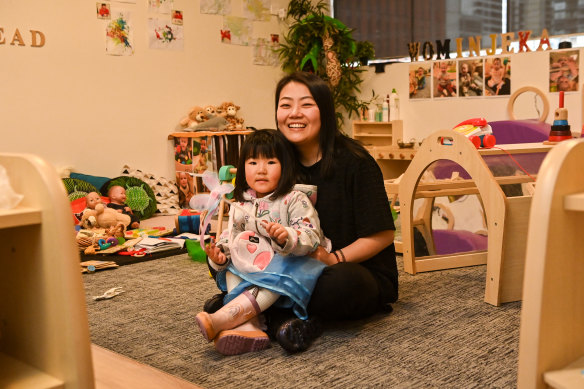 Savannah Sun retrained to become an early learning educator and now works at Kids on Collins, where her daughter, Sylvie Wang, attends.