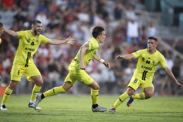 Louis Fenton (centre) secured a late point for the Phoenix.