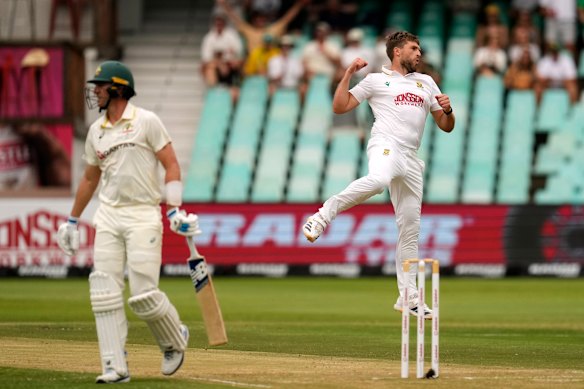 South Africa’s Wiann Mulder, right, celebrates after dismissing Australia’s Pat Cummins on day two.