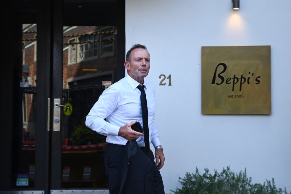 Former prime minister Tony Abbott leaves Beppi’s restaurant in Darlinghurst after the funeral. 