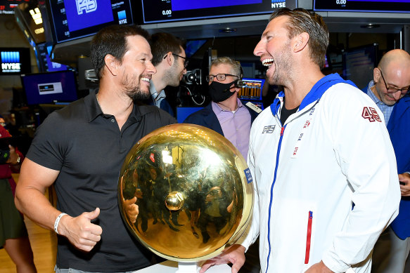 Mark Wahlberg (L) and F45 founder and CEO Adam Gilchrist at the New York Stock Exchange in July.