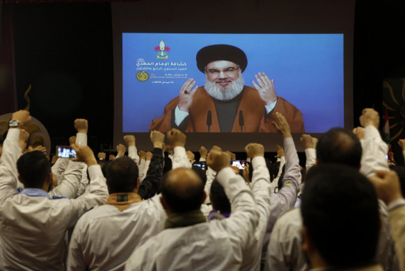 Hezbollah leader Hassan Nasrallah speaks to supporters in southern Beirut via video link.