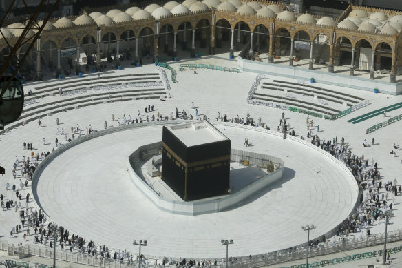 Few worshippers were allowed to enter after dawn prayers to circumambulate the Kaaba in the Grand Mosque over fears of coronavirus.