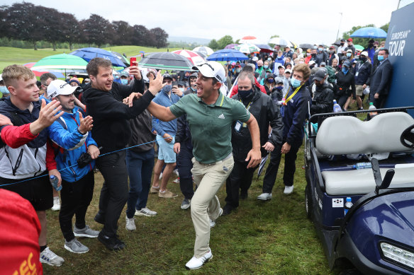 Lucas Herbert of Australia  celebrates with fans after winning The Irish Open in 2021.