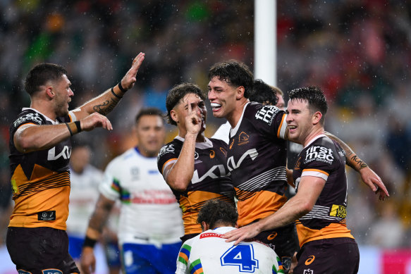 Jordan Riki celebrates scoring for the Brisbane Broncos against the Canberra Raiders.