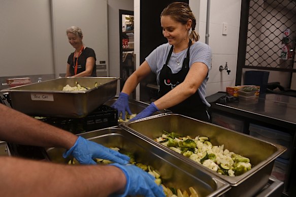 Hayley Dickerson leads volunteers in the kitchen in feeding hundreds of people each week.