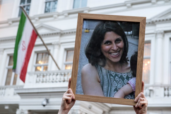 Supporters hold a photo of British-Iranian mother Nazanin Zaghari-Ratcliffe, whose jail sentence was recently extended by a year. 