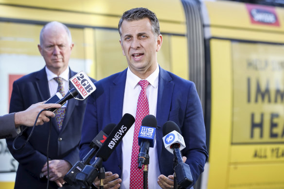 NSW Transport Minister Andrew Constance, flanked by Transport for NSW chief operations officer Howard Collins, asks for Sydneysiders to be cautious around trams.