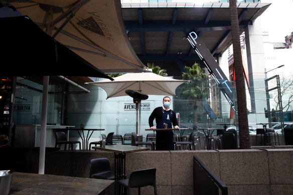 Philip Barbaro, owner of Avenue on Chifley cafe, which is empty during the lunch hour. 
