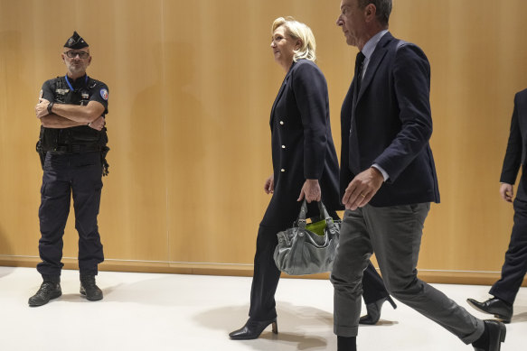 Marine Le Pen leaves the courthouse after the first day of trial.