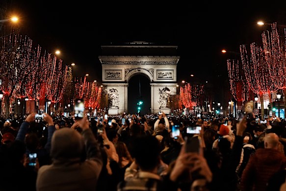 No fireworks but some Parisians bought tickets to see in the new year on the Champs Elysee. 