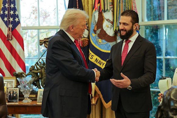 US President Donald Trump shakes hands with Syria’s President Ahmad al-Sharaa at the White House in November.