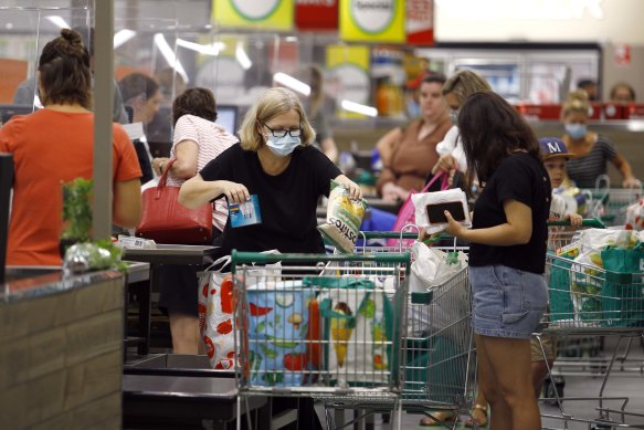 Masked shoppers queue at the Cannon Hill shopping centre in Brisbane’s south-east after the announcement of a three-day lockdown in January 2021.