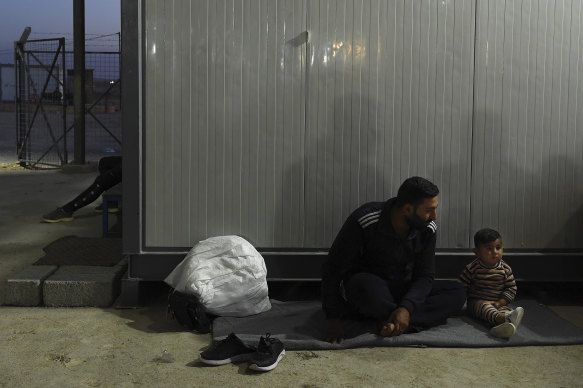 Hamid Abadi and his two-year-old son Fawaz, from Ras Al Ain in Syria, fled into Iraq.  