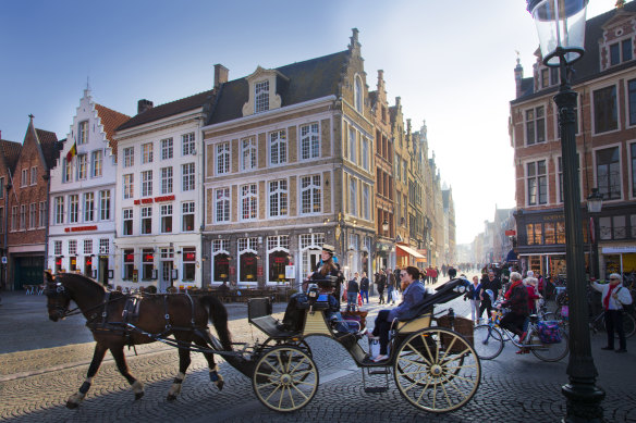 Horsedrawn carriages add to the fairytale quality of Bruges.