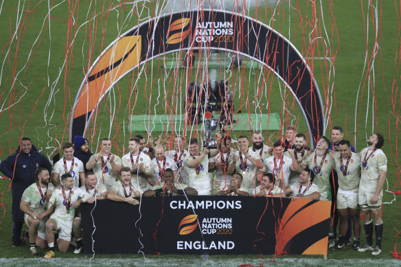 Owen Farrell holds the trophy aloft after England beat France to win the Nations Cup.