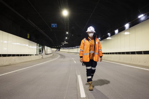 A worker walks through one of the Rozelle interchange’s road tunnels.