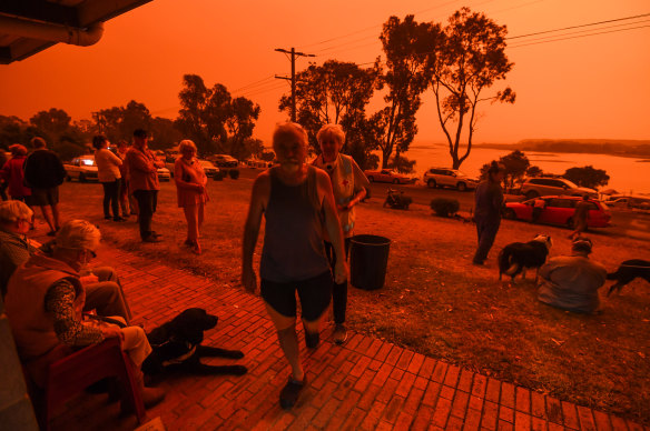 Locals in Mallacoota in January as fires devastated the region over summer 2020. Ms Lloyd was a key player in the recovery.