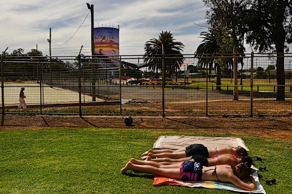 Hayley Bodycott (far), Nishtha Patel and Sophie Walsh (front) dry off after a swim at the War Memorial Pool in Nyngan.