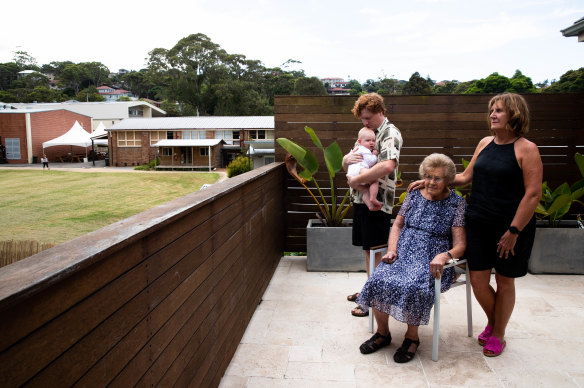 Lillian Morton, 99, with daughter Nerida Walton, grandson Jarrod Walton and great-grandson Reginald at their Brookvale home, which is surrounded by St Augustine’s College.