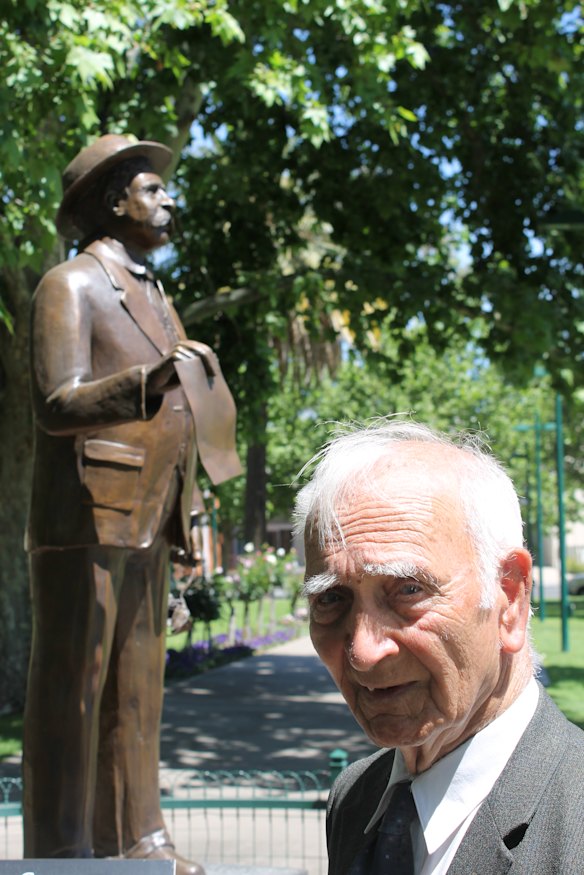 Uncle Boydie with a statue of his grandfather, William Cooper, in 2018.
