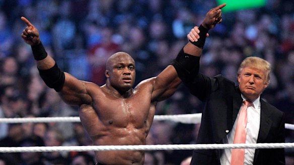 Donald Trump raises the arm of wrestler Bobby Lashley after he defeated Umaga at WWE's Wrestlemania 23 in 2007.