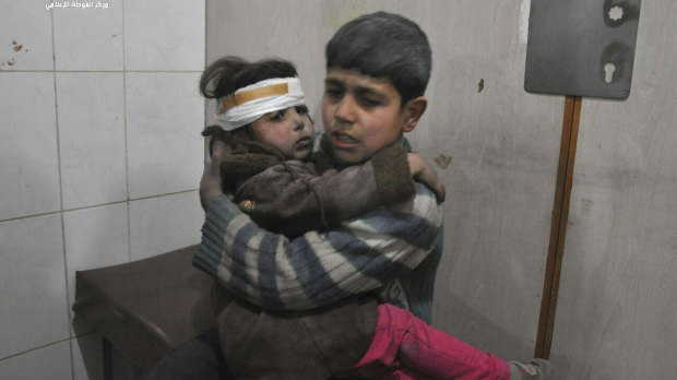 Children are treated in hospital after homes in Ghouta were bombed by government forces.