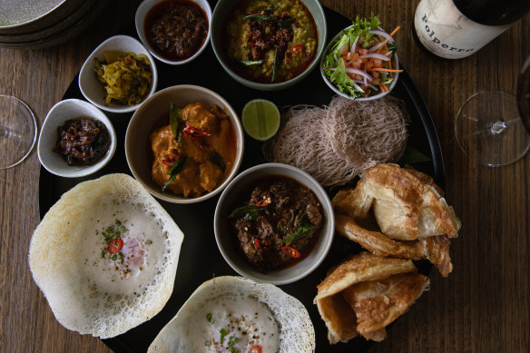 Hopper thali, with egg hoppers, curries, dhal, roti, red rice string hopper, devilled potatoes and condiments at Many Little, Red Hill.
